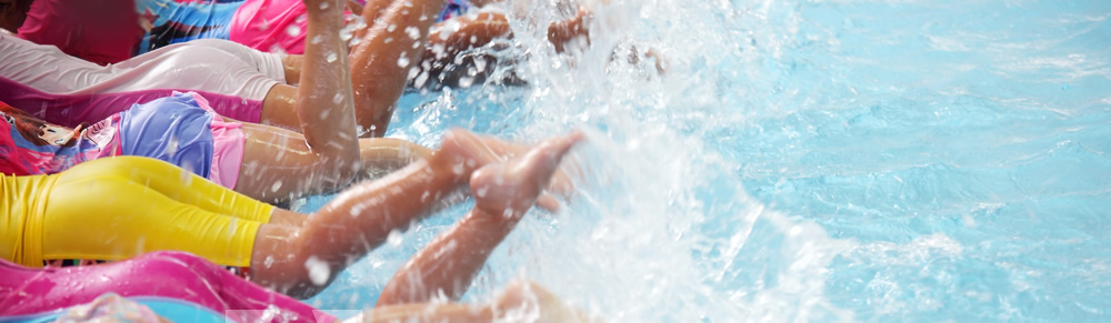 Swimmers kicking in pool